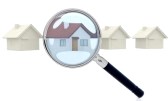 7631948-looking-for-a-house-through-a-magnifying-glass--isolated-over-white